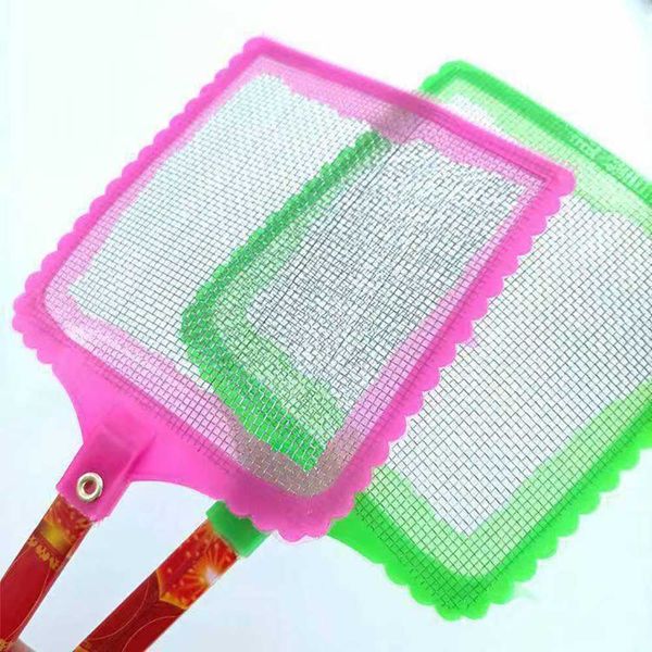 Large fly swatter with a long handle and an unbreakable head, with a scratcher on the other side. An old-fashioned plastic household manual fly swatter.