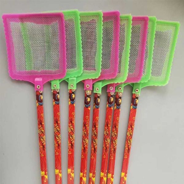 Large fly swatter with a long handle and an unbreakable head, with a scratcher on the other side. An old-fashioned plastic household manual fly swatter.
