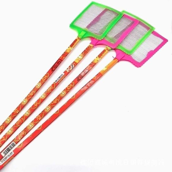 Large fly swatter with a long handle and an unbreakable head, with a scratcher on the other side. An old-fashioned plastic household manual fly swatter.